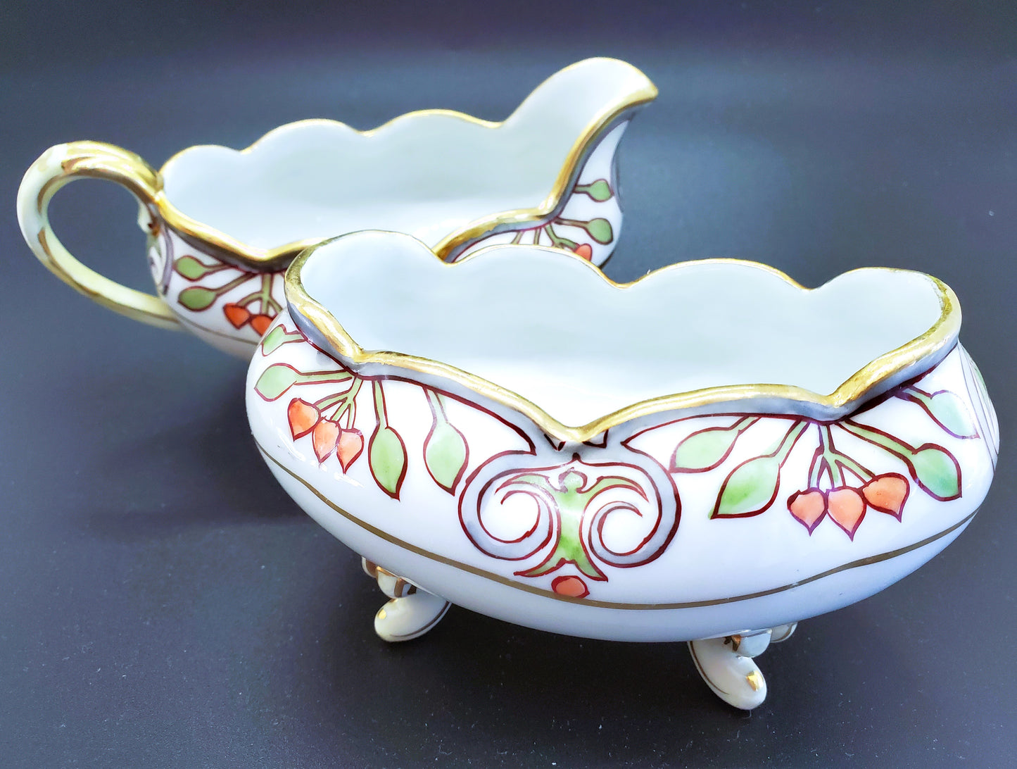 Vintage Hand-Painted Porcelain Cream and Sugar Set With Feet And Gold Guilding