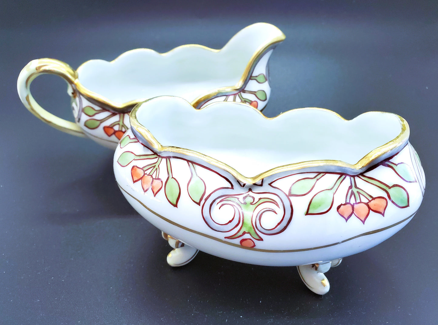 Vintage Hand-Painted Porcelain Cream and Sugar Set With Feet And Gold Guilding