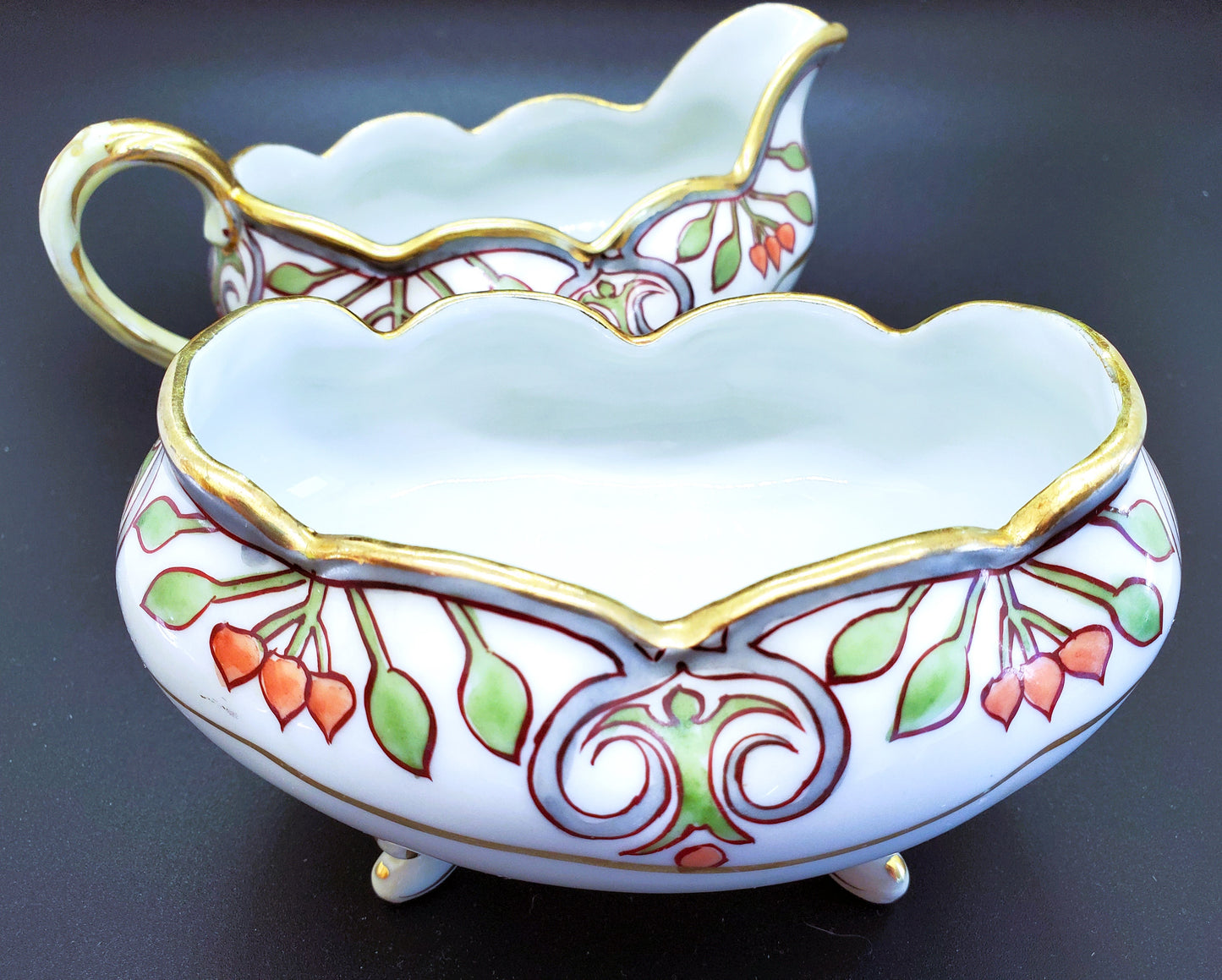 Vintage Hand-Painted Porcelain Cream and Sugar Set With Feet And Gold Guilding