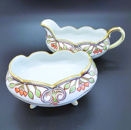 Vintage Hand-Painted Porcelain Cream and Sugar Set With Feet And Gold Guilding